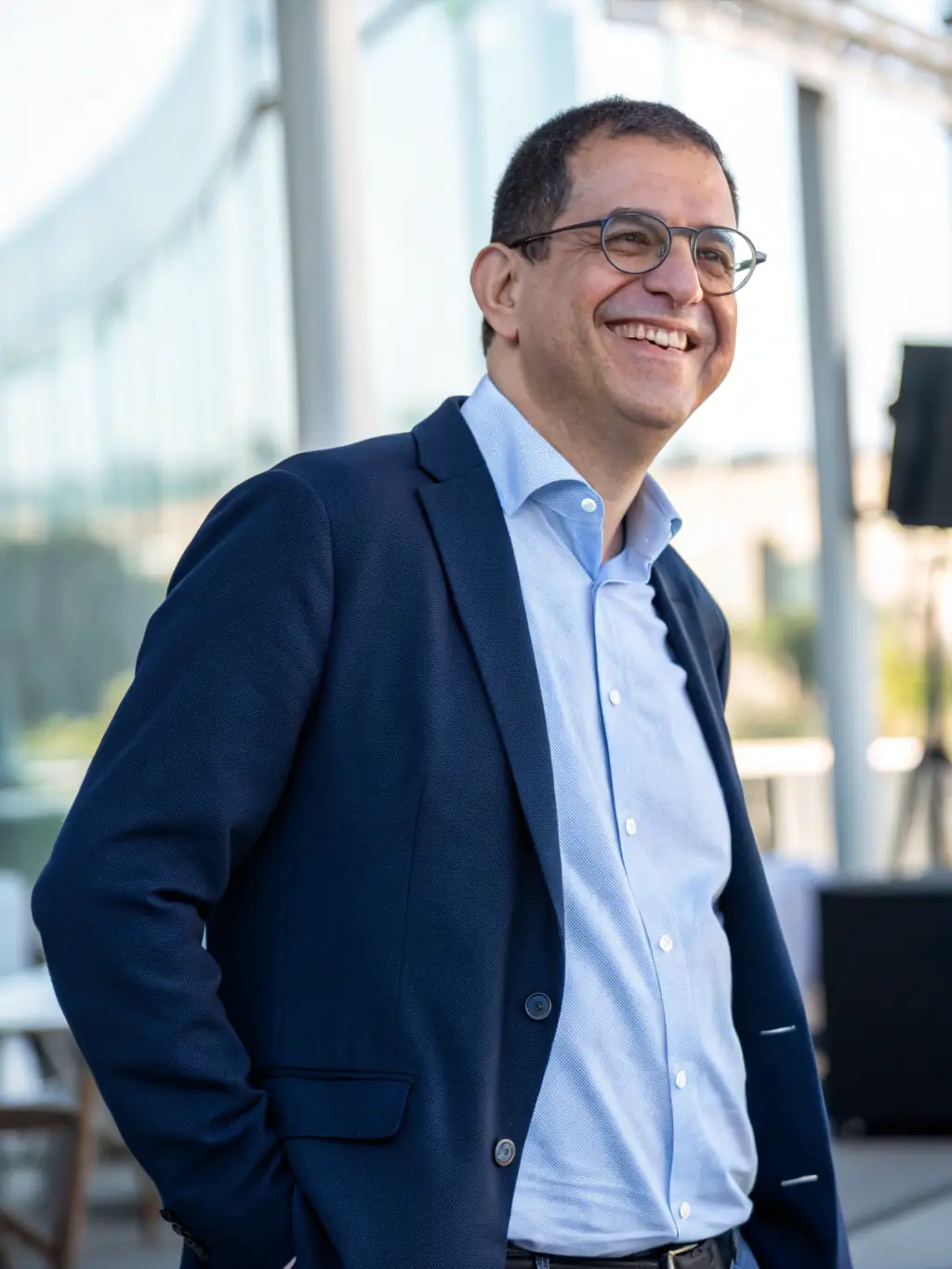 A professional headshot of a forum member, Michael, who is a known expert in mobile security, against a backdrop of abstract digital patterns.